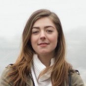 A picture of a smiling young woman with long light brown hair.